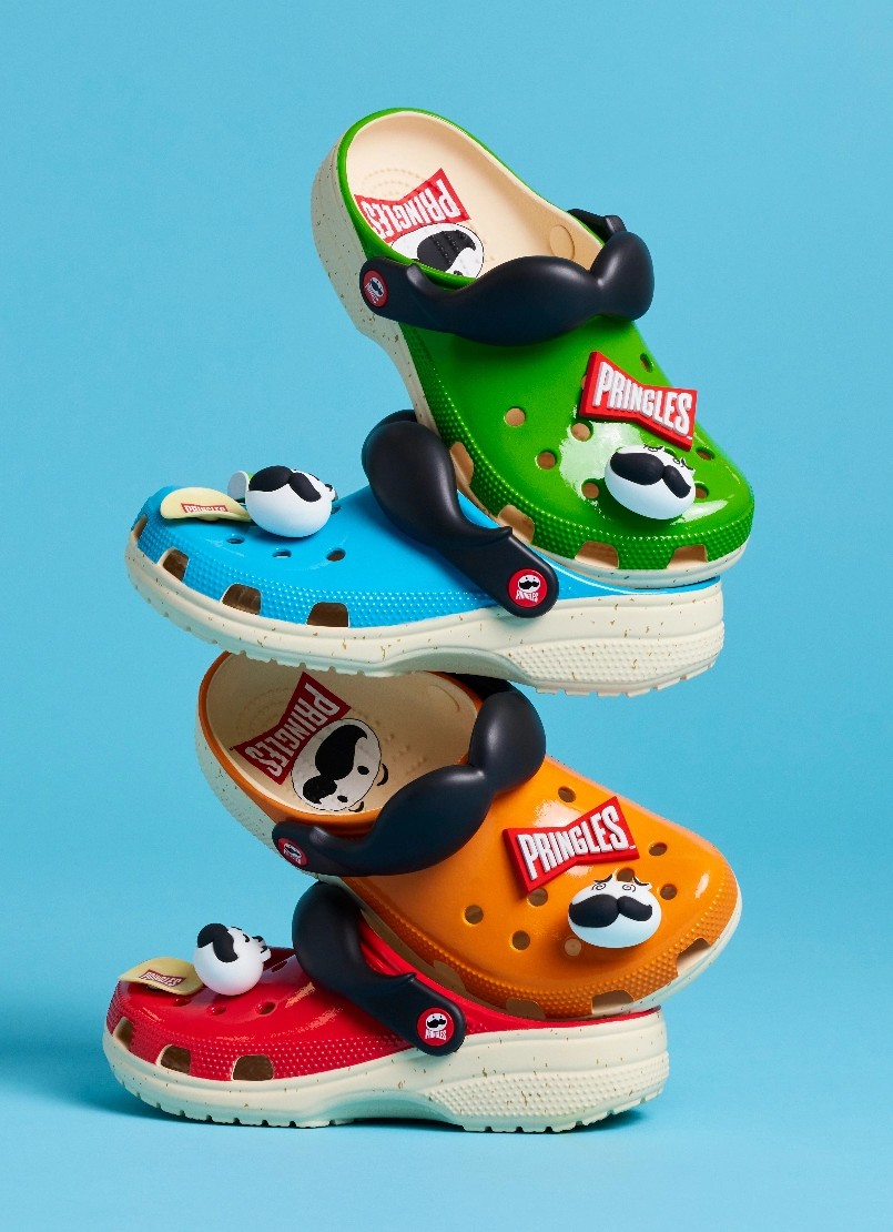 4 stacked pringles-branded crocs shoes in various colors