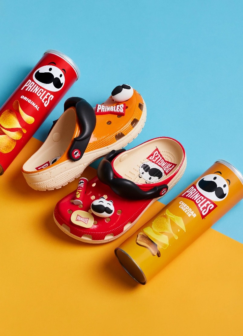 cheddar and original pringles crisps cans and matching crocs shoes