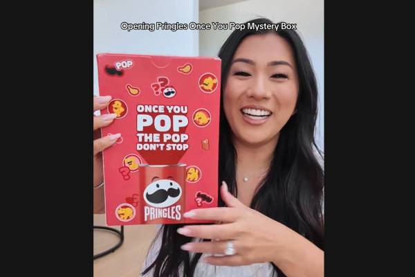 influencer missremiashten holding the once you pop mystery box